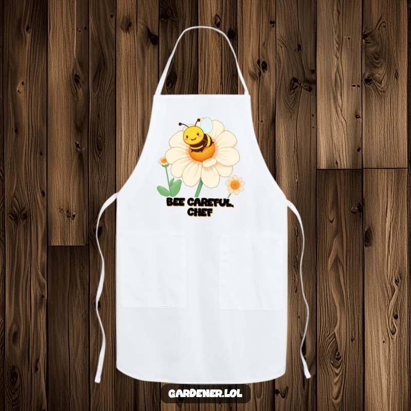 Funny bee flower apron showing a smiling character hovering over a giant blooming flower, perfect for kitchen fun.