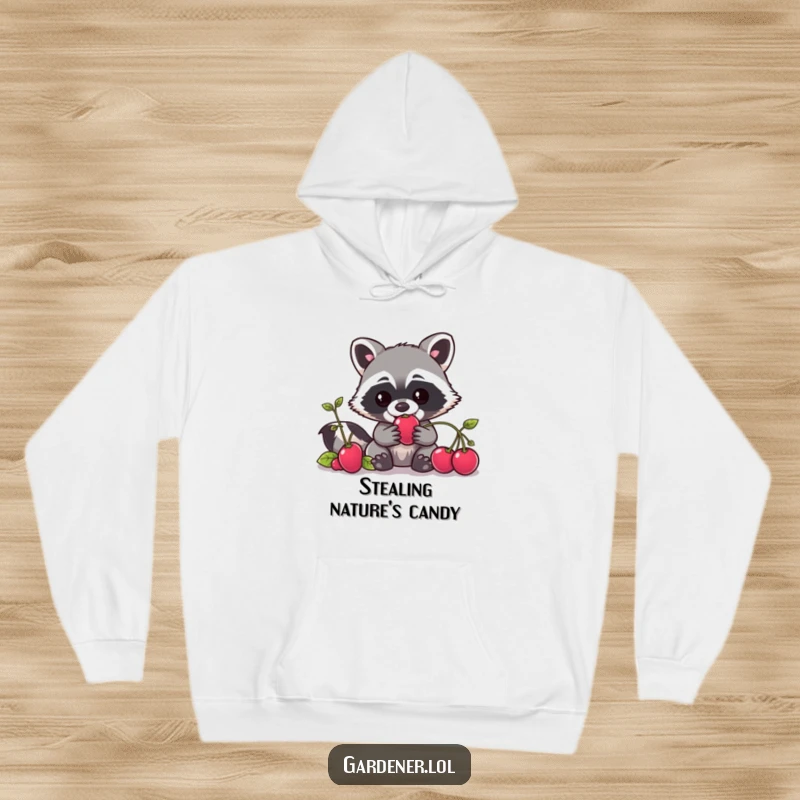 Funny Kawaii raccoon gardener hoodie depicting a sneaky character trying to grab a berry, excellent for gifting.