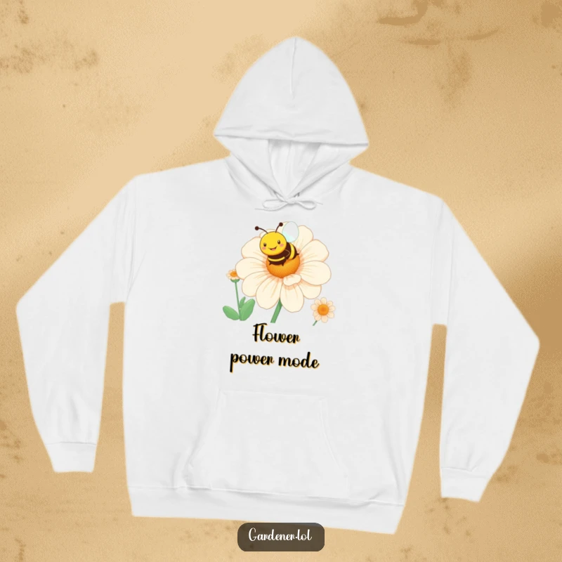 Funny bee hoodie with a smiling character hovering over a giant blooming flower, perfect for cozy, sunny days.