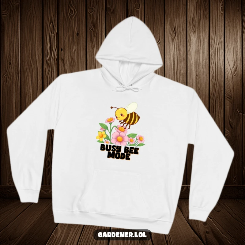 Funny hoodie featuring a busy bee character energetically pollinating a flower, offering warmth and a charming garden-themed humor.