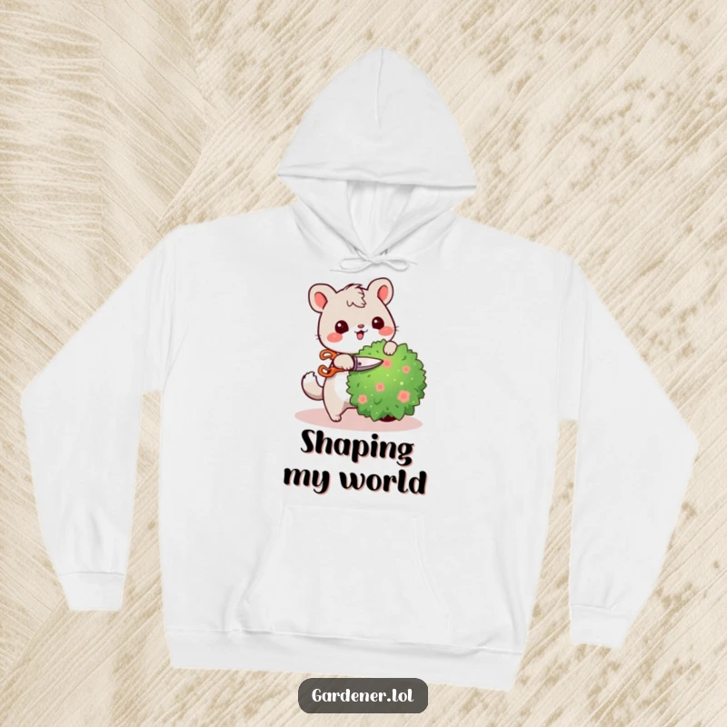 Funny hoodie with a cute animal character happily pruning a bush with tiny shears, offering warmth and a humorous gardening theme.