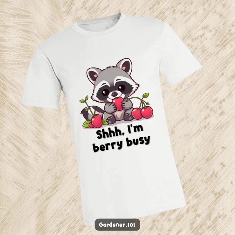 Funny Kawaii raccoon gardener t-shirt showing a mischievous character sneaking a juicy berry, ideal for gift-givers.